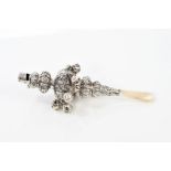 Fine quality Victorian silver child's rattle with embossed rococo floral decoration, eight bells,