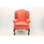 George I-style walnut wing armchair with salmon-pink upholstery,