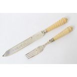 Fine quality cake knife and fork with engraved silver blades and carved ivory twist handle