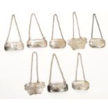 Collection of Georgian and Victorian silver decanter labels with suspension chains - including
