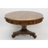 Good George IV mahogany and tulipwood crossbanded drum table with radically veneered top and having