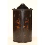 18th century black lacquered bow front hanging corner cupboard with shelved fret gallery and