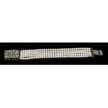 Cultured pearl and diamond bracelet with five strings of 4.