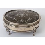 Early George V silver jewel casket of oval form, with velvet interior,