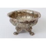 Georgian white metal sugar bowl of circular form, with flared rim and embossed floral decoration,