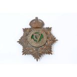 Early 20th century brass 'Kings Crown' Connaught Rangers helmet plate