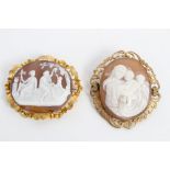 Two carved shell cameo brooches in scroll design yellow metal mounts - one cameo depicts Madonna