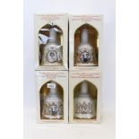 Four Wade Bells whisky decanters and a White & Mackay DeLux 12 Years Old Whisky decanter - all with