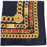 Authentic Chanel black silk scarf with gilt chain design,