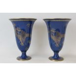 Pair of Wedgwood Dragon lustre vases, pattern no. 24616, with gilt dragons on a blue ground, 21.