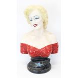 Large portrait bust of Marilyn Monroe in a red dress,