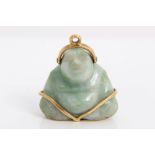 Chinese carved jade figure of a Buddha, with gold (18ct) mounts,