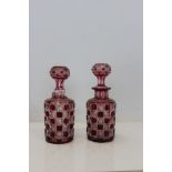 Pair of ruby cut glass decanters with stoppers