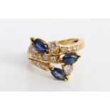 Portuguese gold (800) sapphire and diamond crossover ring.