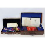 Two leather cases containing a selection of Masonic regalia and paperwork (qty)