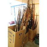 Large quantity of vintage and modern fishing rods in glass fibre,