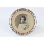 Late 19th century enamelled photograph frame of circular form, with rose ornament, 11.