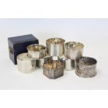 Eight early 20th century and contemporary silver napkin rings - including one cased (various dates