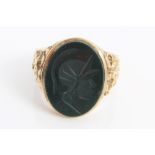 Gentlemen's gold (9ct) signet ring with oval bloodstone panel depicting a centurion head.