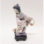 Lladro porcelain figure of a Japanese Geisha girl picking flowers, entitled - Michico,