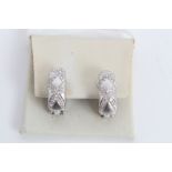 Pair of white gold (18ct) diamond half hoop earrings with diamond set criss-cross design and stud