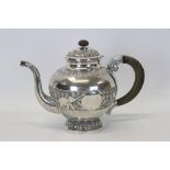 Indian white metal teapot of globular form,