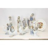 Ten Nao porcelain figures - including boy with chamberstick, boy praying, couple with basket,