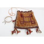 Old African drawstring fabric bag with embroidered design and cowrie shells - sold with a Chinese