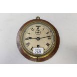 Early 20th century ships' bulkhead clock with white enamel dial, Roman numerals,