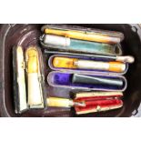 Gold mounted cigarette holder and other silver mounted and sundry cheroot holders in cases