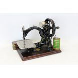 Victorian Wilcox & Giles sewing machine and accessories in pine case