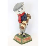 Original Dunlop golf ball advertising figure in the form of a golfer with golf ball head and bag