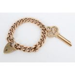 Gold (9ct) curb link bracelet with padlock clasp and gold (9ct) key pendant / charm