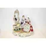 Large Continental porcelain figure group - two ladies next to dressing table,
