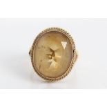 Gold (9ct) yellow stone dress ring.