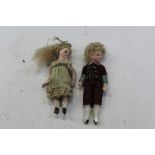 Two antique doll house dolls - bisque heads - girl and boy,