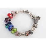 Pandora Moments silver charm bracelet with various silver and glass charms