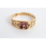 Edwardian gold (18ct) ruby four stone ring with engraved scroll shoulders (Chester 1902).