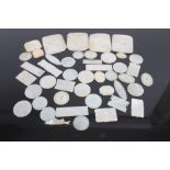 Collection of thirty-six late 19th century Chinese mother of pearl gaming counters of various forms,