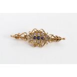 Victorian diamond and sapphire bar brooch with three central mixed cut blue sapphires surrounded by