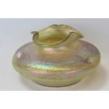 Loetz-style iridescent glass vase of squat form, with fluted rim,