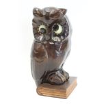 Novelty German timepiece in the form of an owl standing on a book,