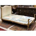 French carved walnut and parcel gilt single bed with upholstered headboard in channel carved frame,