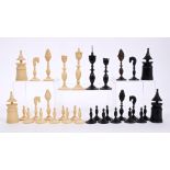 Rare 19th century Vizagapatam carved ivory and black stained ivory chess set - the largest piece 11.