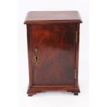 George III mahogany spice cupboard with moulded rectangular top and single door enclosing fitted