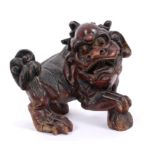 19th century Chinese red lacquered Dog of Foo with glass eyes,