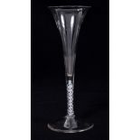 Georgian toasting glass with long trumpet bowl and fine double opaque-twist stem on splayed foot,