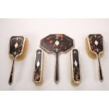 1930s silver and tortoiseshell five piece brush and hand mirror set,