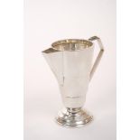 1930s Art Deco silver cream jug of tapered cylindrical form, with angular handle and spout,