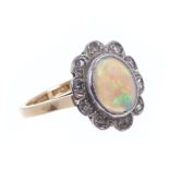 Opal and diamond cluster ring with an oval opal cabochon surrounded by a border of rose cut